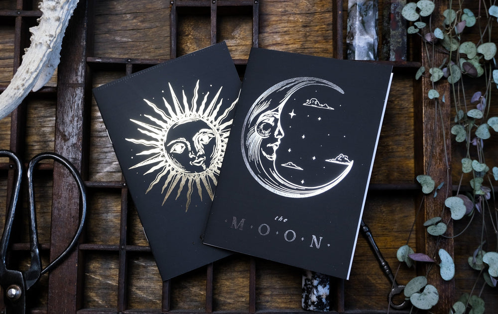 Sun and Moon celestial wedding vow books with gold and silver foil sun and moon covers