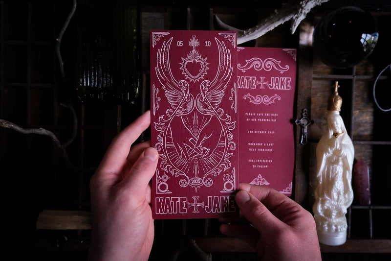Star-Crossed Lovers Save the Date card with gothic crossed swords and bleeding heart illustration on matte card