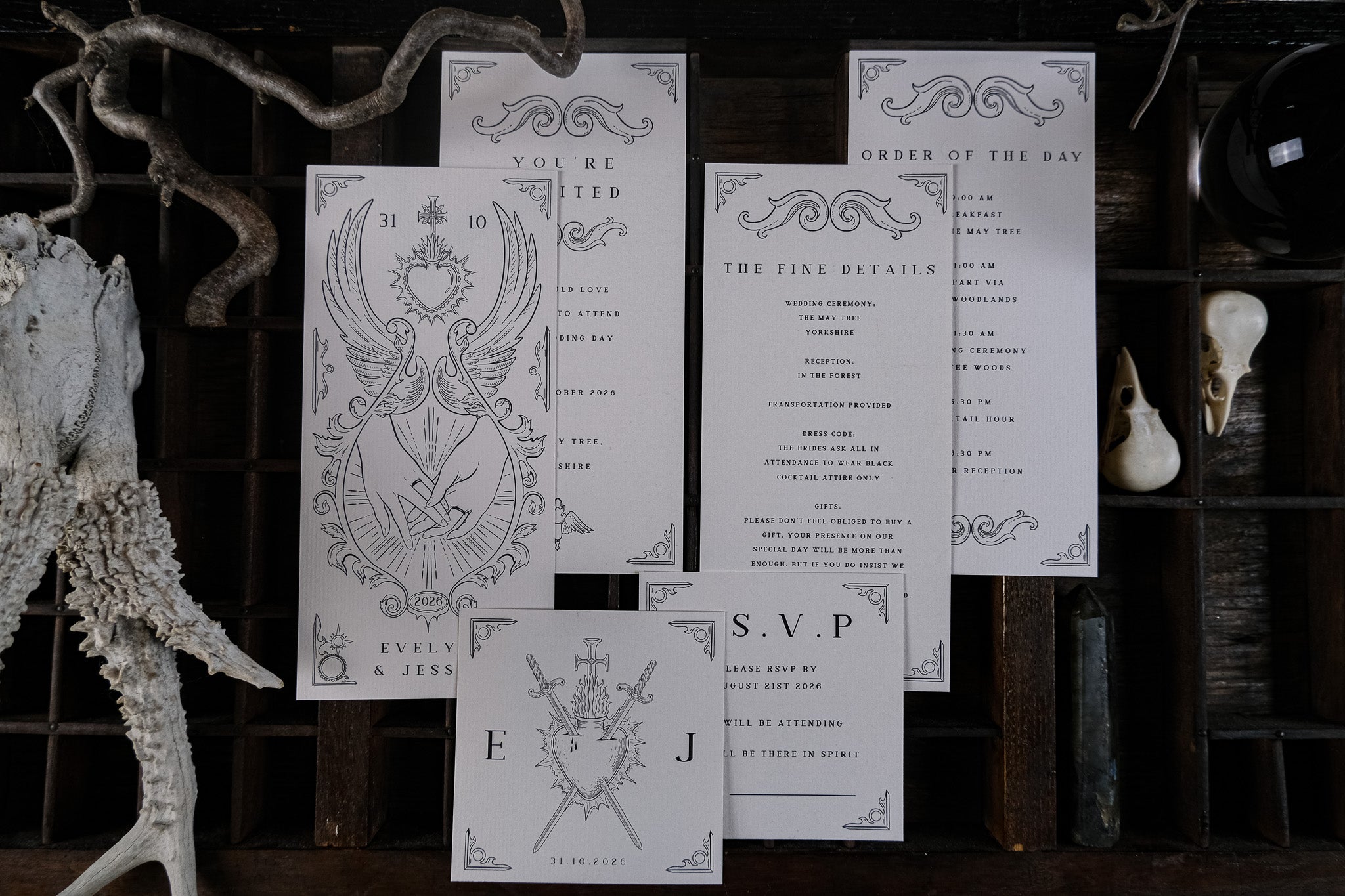 Luxury UK wedding stationery suite featuring dramatic gothic illustrations, vintage-inspired details, and fine textured cardstock.