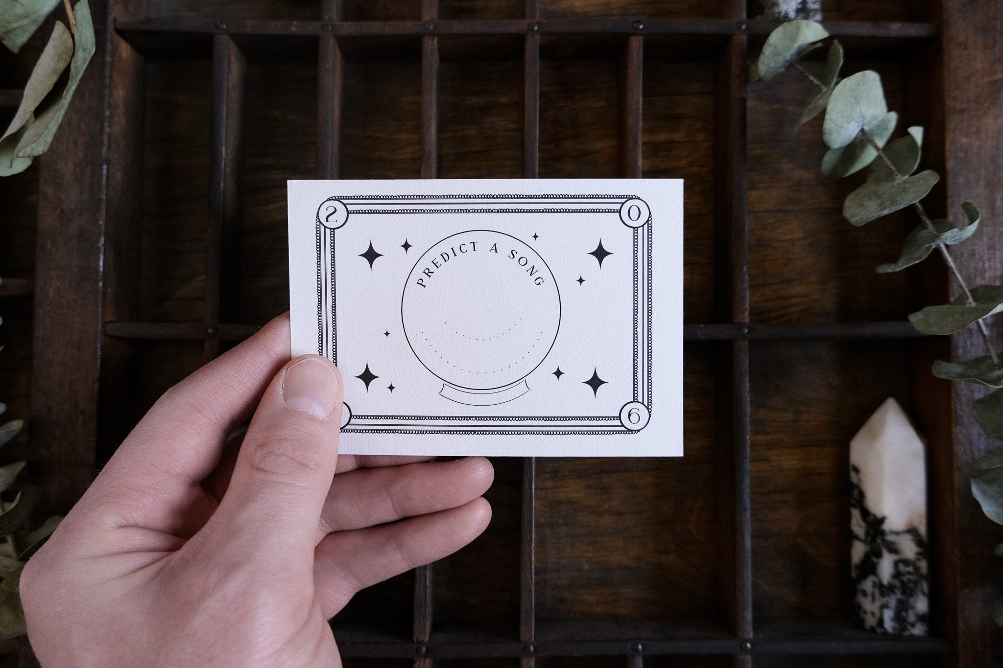 Gothic Ouija-inspired wedding RSVP card with spirit board design and white envelope