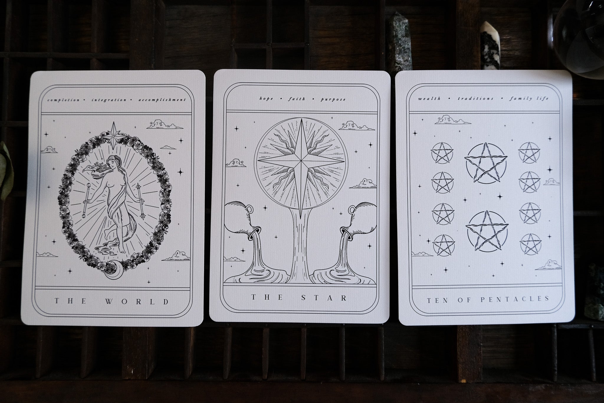 Luxury UK wedding stationery card with minimalist grayscale line art in a gothic, mystical tarot style; dramatic and romantic design.
