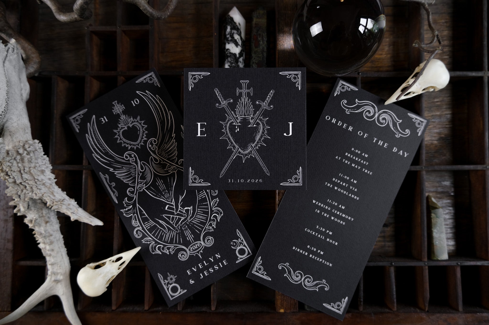 Luxury UK wedding invitation suite with gothic skulls, swords, ornate borders; romantic and dramatic alternative stationery.