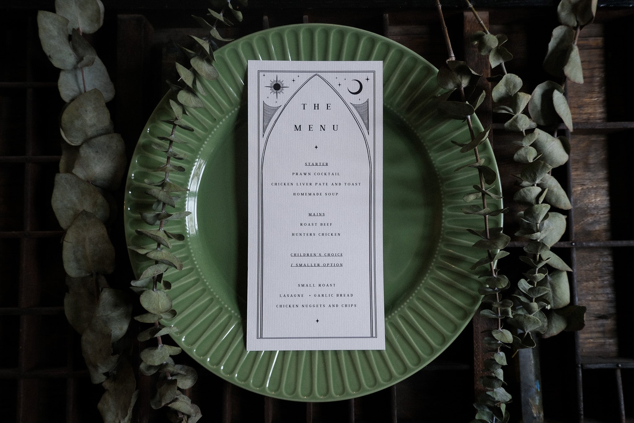 Luxury wedding menu cards in a gothic romantic tarot style, featuring ornate borders for a dramatic, alternative UK table setting.
