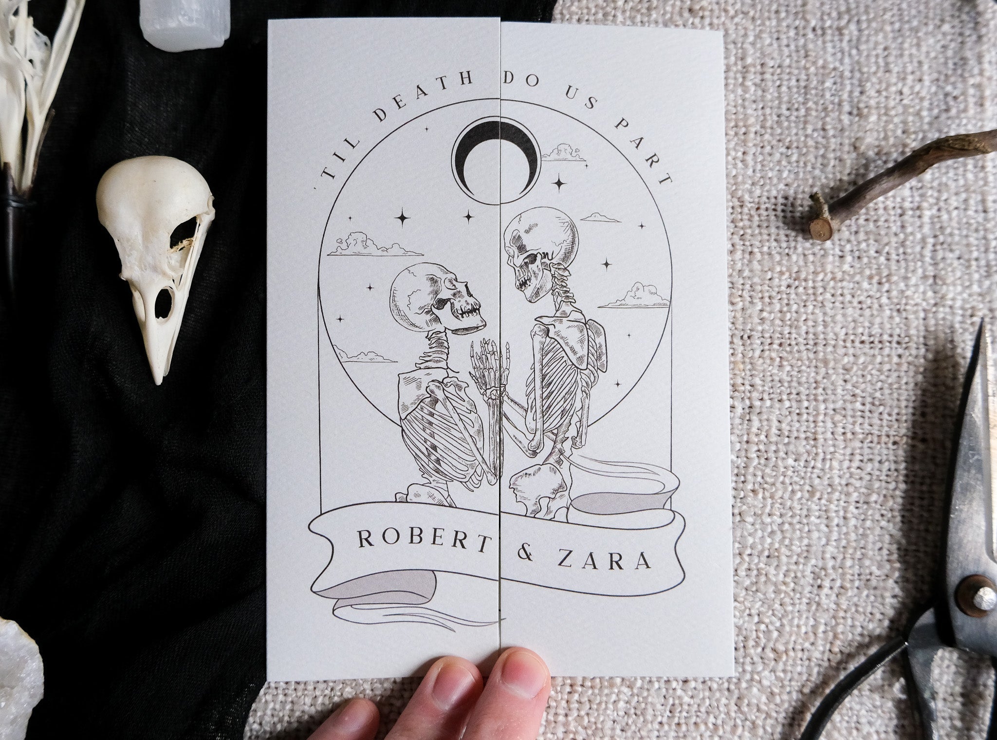 Gatefold wedding invitation with skeleton lovers and bleeding heart gothic design on matte card