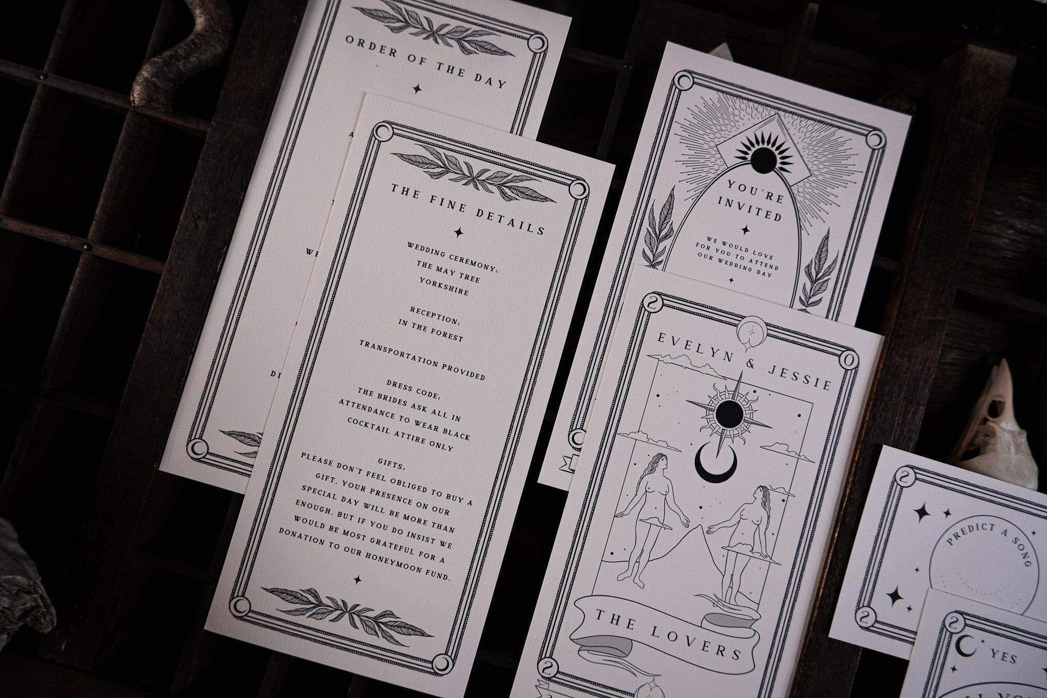 Luxury UK wedding stationery set with gothic, romantic tarot-inspired design, black line art, and celestial accents on premium card.