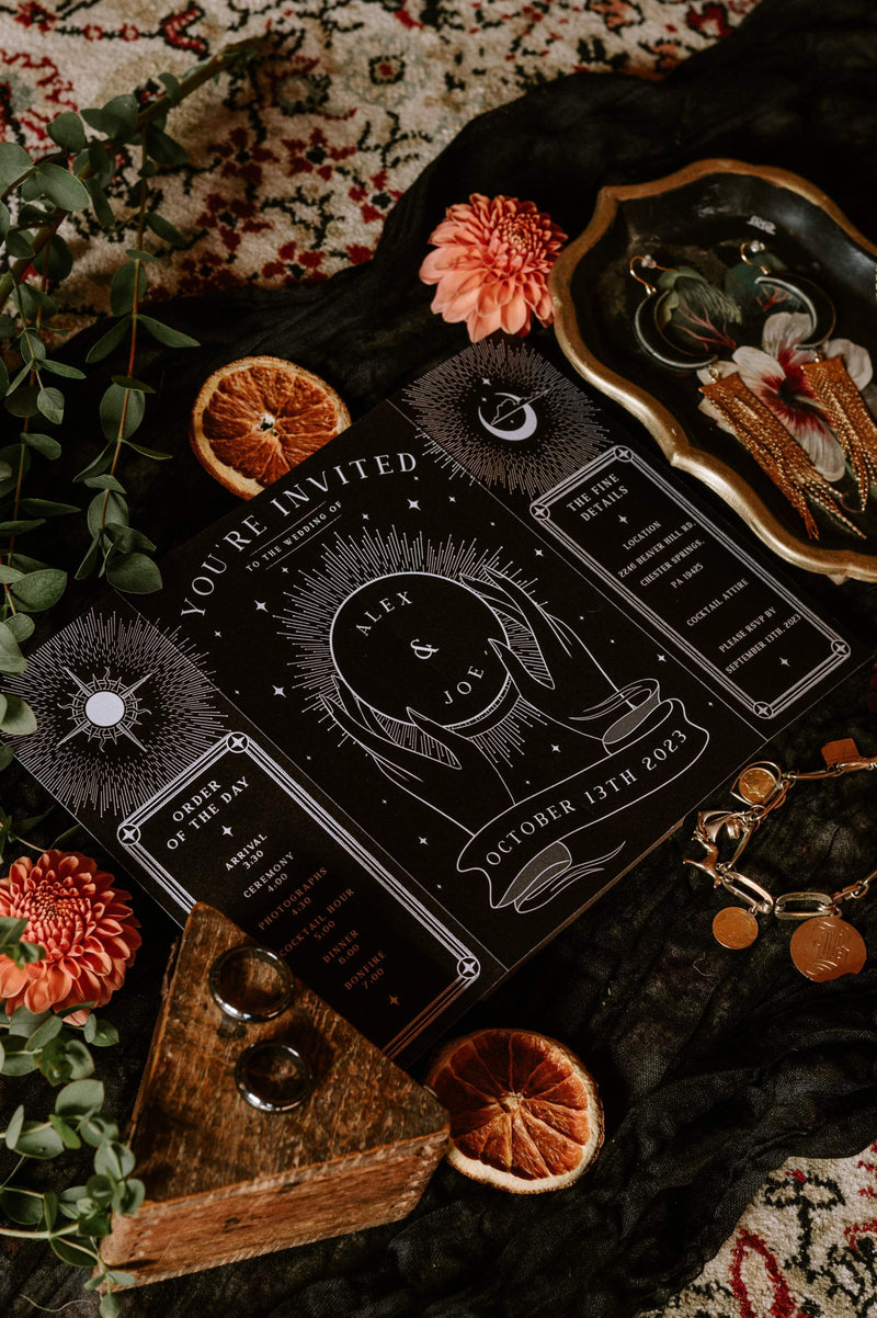 Gothic gatefold wedding invitation with skeleton lovers 'Til Death' crystal ball design on textured matte card