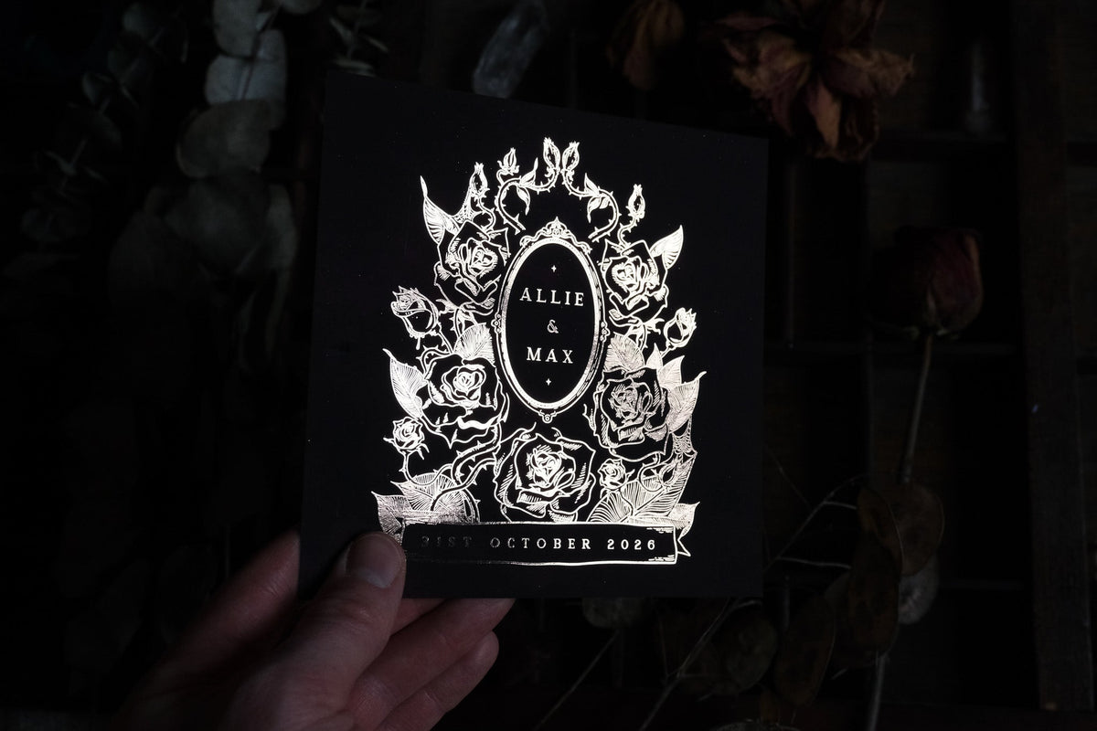 Black Thorned Rose save the date with silver foil florals