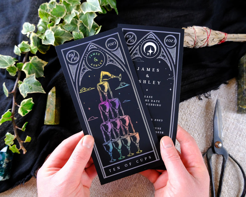 Ten of Cups foiled tarot card save the dates with white envelopes, customizable colors.